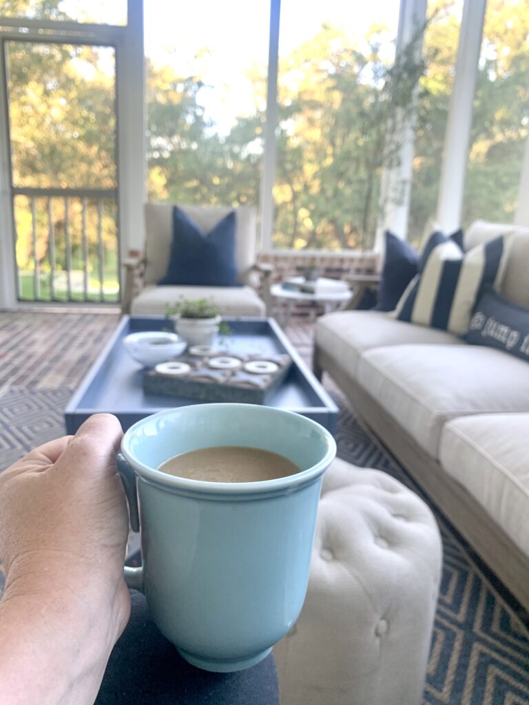 Enjoying a cup of coffee out on a screened in porch