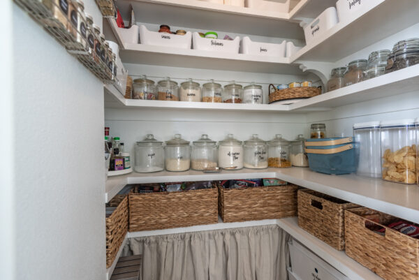 This pantry is looking beautiful and organized after a few improvements, painted Sherwin Williams Pure White