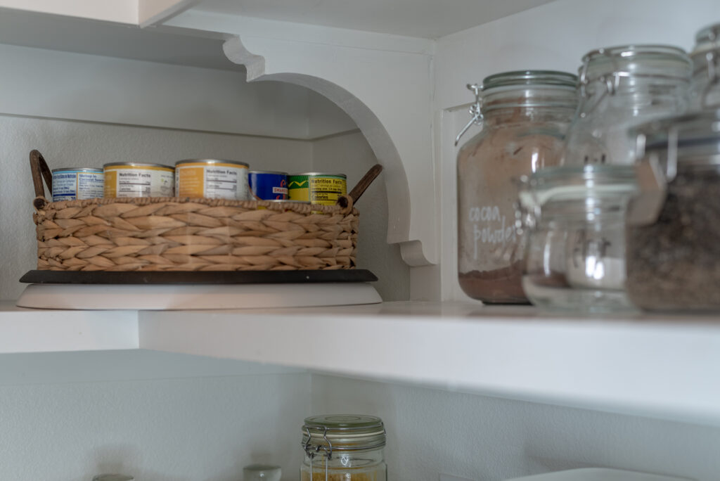 corbels or baskets hold up pantry shelves and add cottage charm