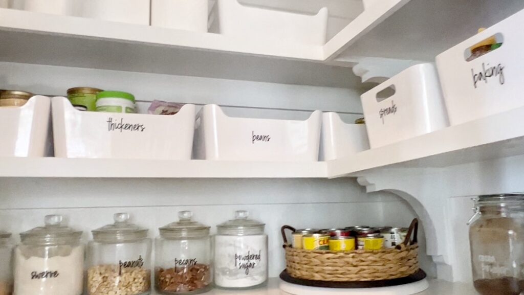 white plastic bins help your organize your pantry