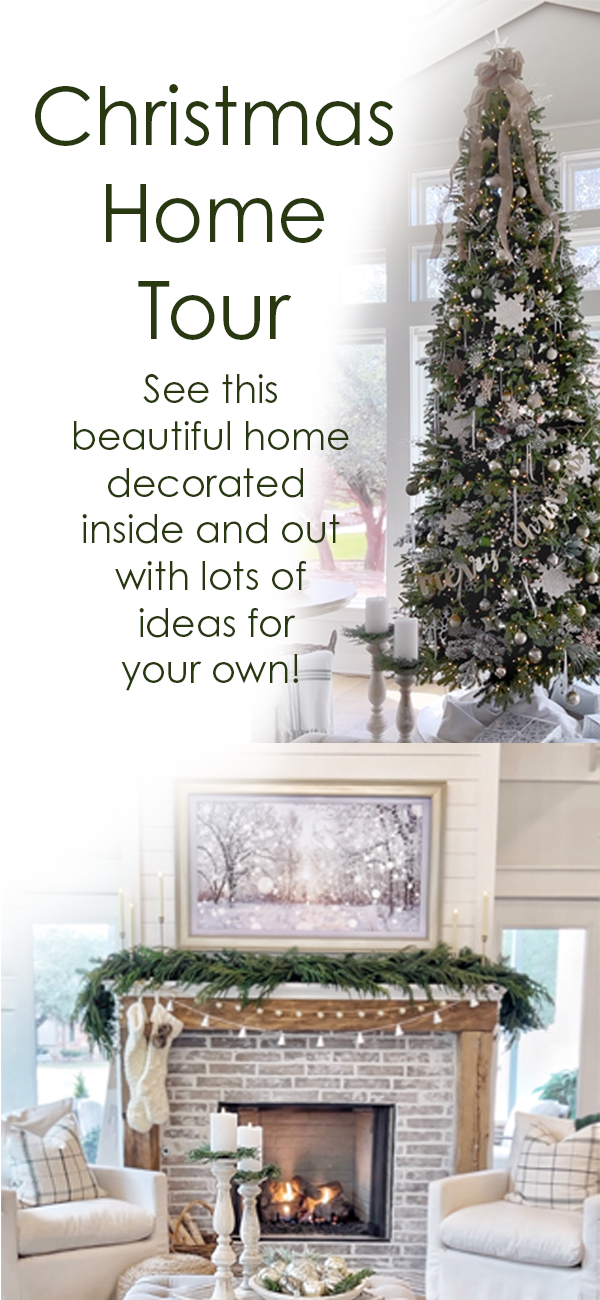 There is a 12' tall Balsam Hill Christmas tree in front of large windows. Its is decorated with white, silver and gold.  There's snowflake and mercury glass ornaments on it.  The image has the words Christmas Home Tour.