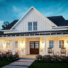 The dogwood Valley exterior at dusk with exposed rafters and a well-lit front porch